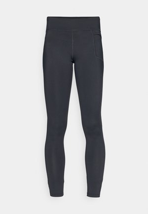Leggings noirs en matière extensible, dotés d'une taille haute et d'une poche latérale, avec des coutures flatlock pour le confort.