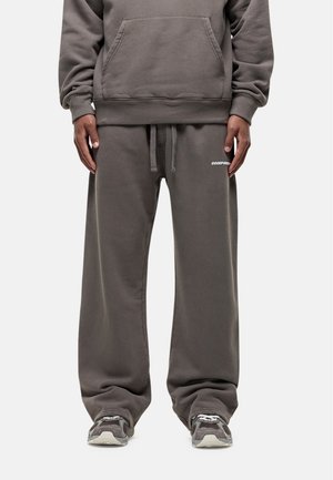 Gray cotton sweatshirt and matching sweatpants with side pockets. Sweatpants feature a drawstring waist and a small logo on the leg.