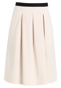 Jupe pliss�ée en tissu beige clair avec une taille élastique noire, dotée d'un design évasé et d'une texture lisse.