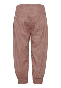 Pantalon rose à taille élastique et aux revers avec un motif texturé subtil et le nom de la marque Pulz sur la ceinture arrière.