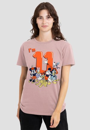 Light pink t-shirt featuring a colorful graphic of cartoon characters and the text "I'm 11" in bold orange. Cotton material, short sleeves.