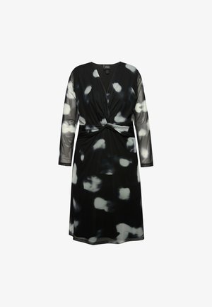 Robe noire avec un décolleté en V et de longues manches en tulle, présentant un détail noué à la taille et un motif abstrait blanc sur l'ensemble.