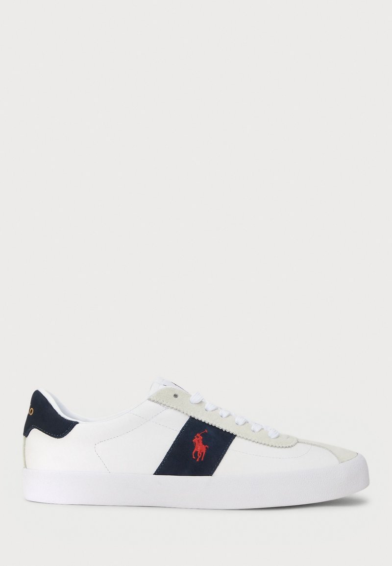 Men's athletic sneakers in white leather with navy accents. Features a red logo, textured suede, and a low-profile rubber sole.