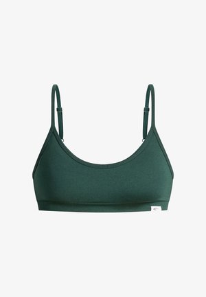 Reggiseno sportivo verde in tessuto liscio, con sottili spalline regolabili, scollo tondo e una targhetta con il logo sul lato.