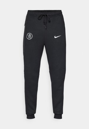 Pantaloni sportivi neri realizzati in morbido tessuto, con due tasche laterali, polsini a costine e loghi bianchi del Chelsea FC e di Nike.
