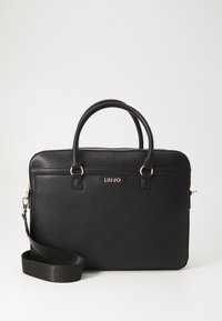 Sac d'ordinateur portable en similicuir noir avec double poignée, bandoulière amovible, ferrures dorées et branding visible. Texture lisse.