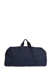 Tmavě modrá sportovní taška z odolné textilie, vybavená dvěma horními uchy a zipovým uzávěrem. Obdélníkový tvar s výrazným prošíváním.