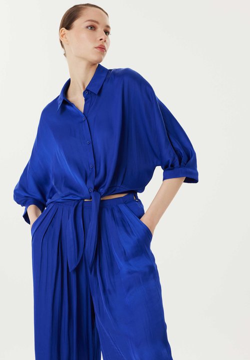 waist twist combinaison