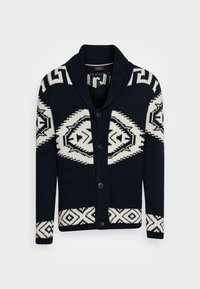 Cardigan bleu marine avec motifs géométriques crème, col châle et fermeture à boutons sur le devant. Poignets et ourlet côtelés pour ajouter de la texture.