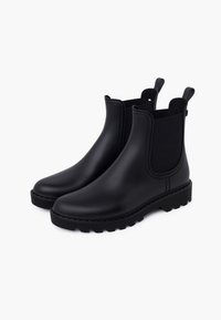 Botas de tobillo impermeables negras hechas de goma, con paneles laterales elásticos, una suela texturizada para agarre y tiradores para facilitar el calzado.