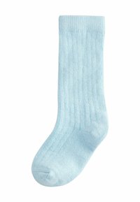 Chaussette en tricot bleu clair avec une texture côtelée. Dotée d'un orteil et d'un revers renforcés. Fabriquée à partir d'un matériau doux et extensible pour le confort.