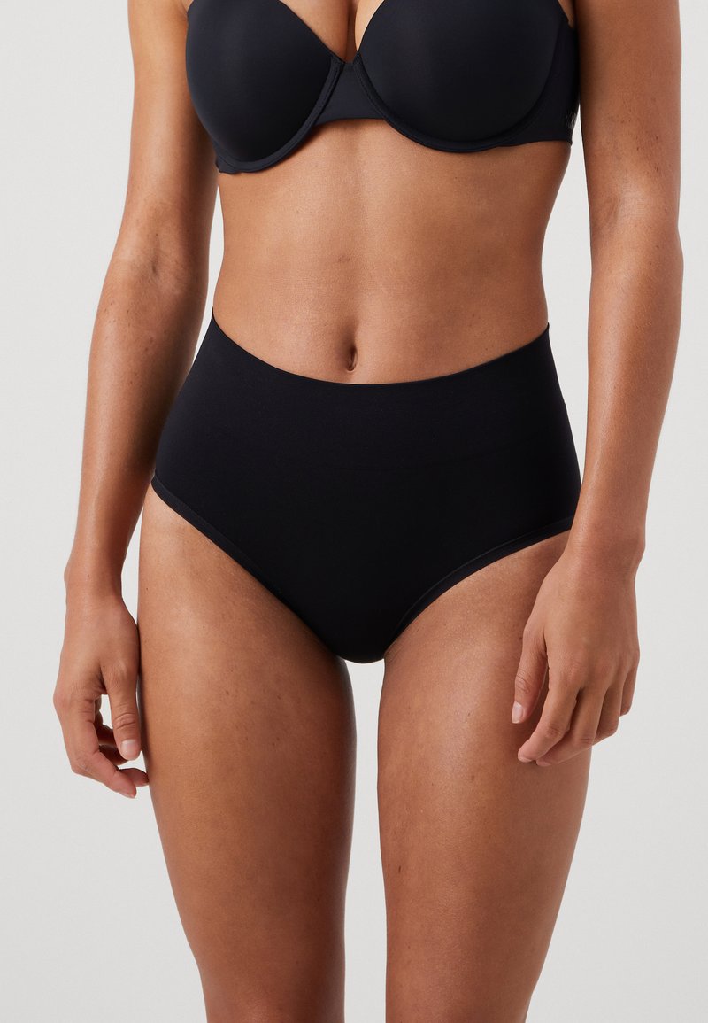 High-waisted black seamless underwear made from soft fabric, featuring a smooth texture and no visible seams for a clean, minimalist design.