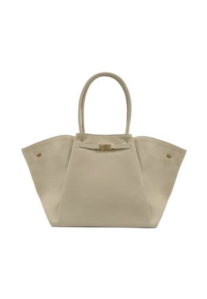 Sac à main en cuir beige avec des côtés larges, des poignées doubles et un petit détail de fermoir doré au centre avant.