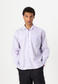 Striped button-up shirt in light purple with white vertical stripes, featuring a pointed collar and a single chest pocket. Crafted from soft fabric.