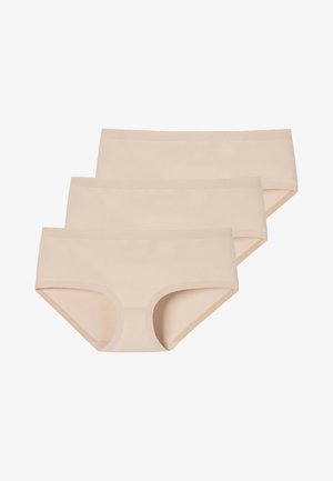 Trzy pary seamless, bawełnianych majtek w jasnym beżu o gładkiej fakturze i szerokim, elastycznym pasie. Prosty i minimalistyczny design.