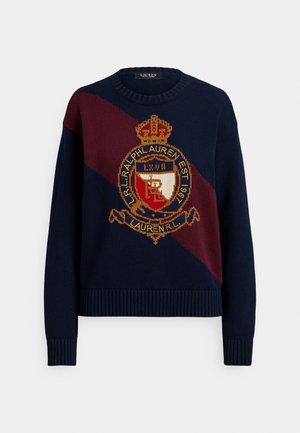 Maglione blu navy lavorato a maglia con una striscia diagonale color granato, caratterizzato da un emblema dorato e polsini e orlo a coste.
