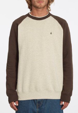 Beige pullover sweatshirt met bruine raglanmouwen; ribgebreide manchetten en zoom; klein logo op de borst; zachte textuur, casual pasvorm.