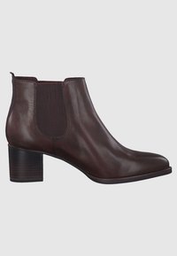 Braune Lederstiefelette mit Blockabsatz, elastischen Seitenpaneelen und glatter Oberfläche. Sie verfügt über eine abgerundete Zehenform und minimale Nähdetails.