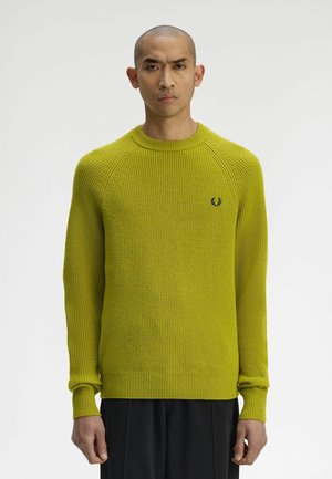 Maglione a maglia costellata di colore verde lime brillante con scollo rotondo, maniche lunghe a raglan e piccolo logo sul petto. Tessuto strutturato.