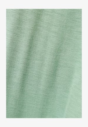 Vihreän vaalean, teksturoitu kangas, jossa on hieno ja hienostunut kudonta. Pehmeä ja sileä pinta, jossa on kevyt kiilto, ihanteellinen arkikäyttöön.