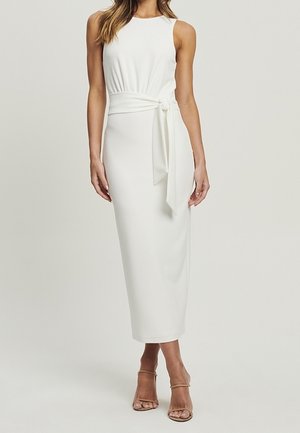 White, sleeveless midi dress with a fitted bodice, gathered waist, and a tied sash. Smooth fabric, minimal design, and ankle-length cut.