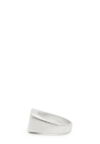 Silver ring with a smooth, polished finish, featuring a triangular design on the front and a rounded band. Textured surface detail.