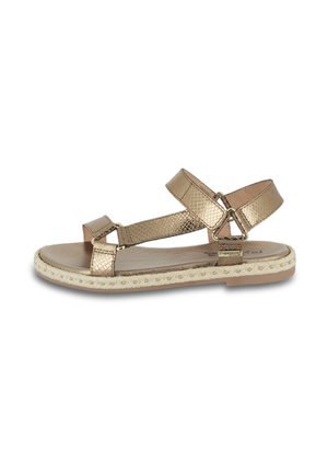 Gold metallic strappy sandal with textured straps, adjustable buckle, and a braided jute sole. Flat heel and open-toe design.