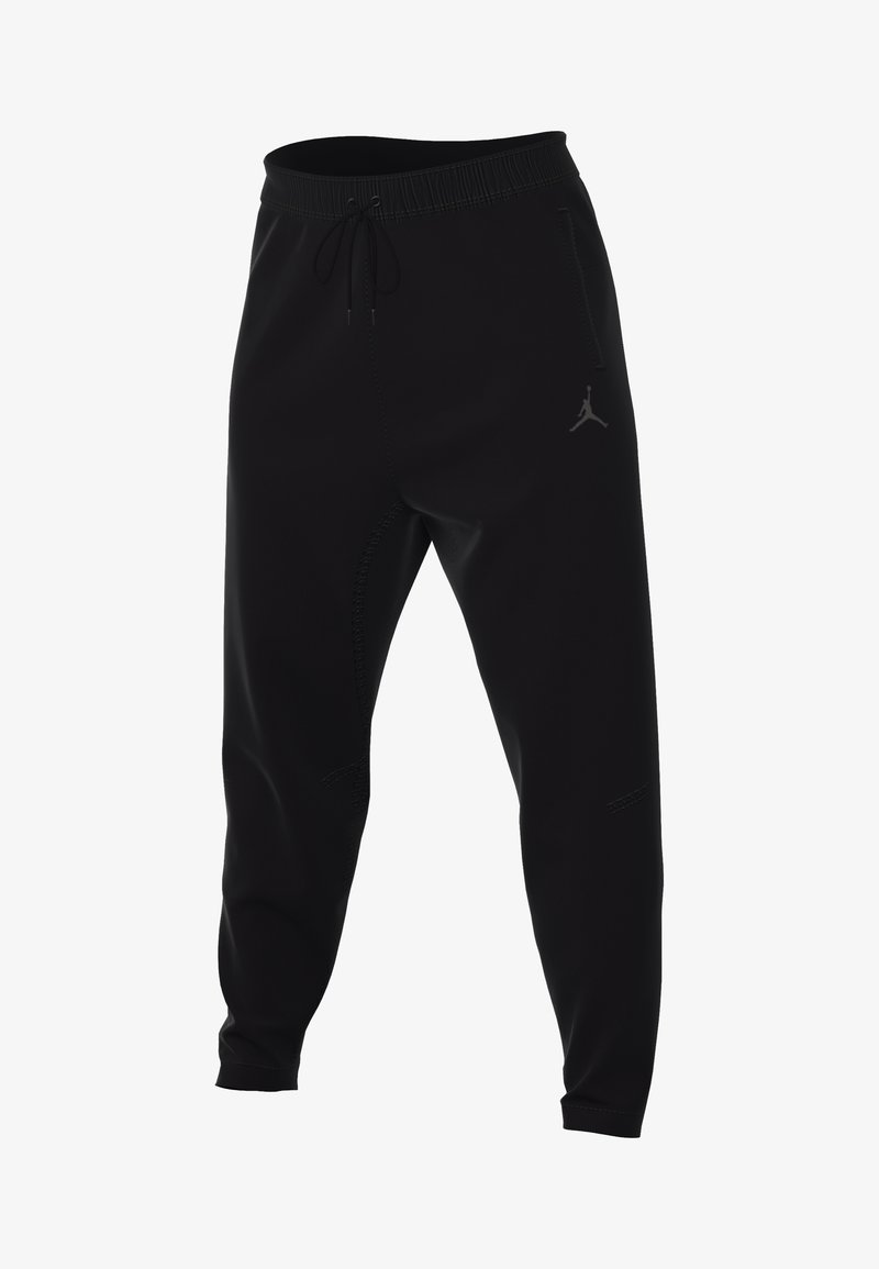 Sorte joggingbukser med elastisk talje, snøre og et diskret logo. Har glat stof, tapered fit og lynlåselementer.