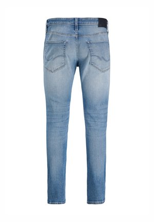 Hellblaue Slim-Fit-Denim-Jeans mit Gesäßtaschen und dezenten Ausbleichungen. Klassisches Five-Pocket-Design mit einem Label am Bund.