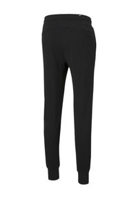 Pantalones de chándal negros con una textura suave, cintura elástica, piernas acampanadas y puños ajustados. Sin patrones visibles ni detalles de herrajes.