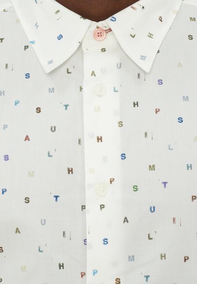 White collared shirt featuring scattered multi-colored letters in various sizes. Two buttons: one pastel pink, one white.