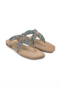 Chanclas beige con un diseño plano, que presentan una tira con joyas adornada con piedras de colores y una plantilla suave y parecida al ante.