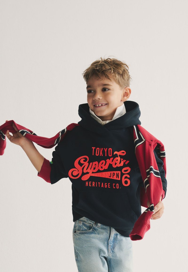 Sweat à capuche Vintage Logo Source rouge hike chiné pours Homme | BE-FR