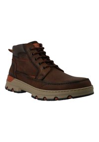 Botas de cuero marrón hasta el tobillo con acentos oscuros, punta redonda, suela de goma beige contrastante y detalles naranjas en el tacón y los cordones.