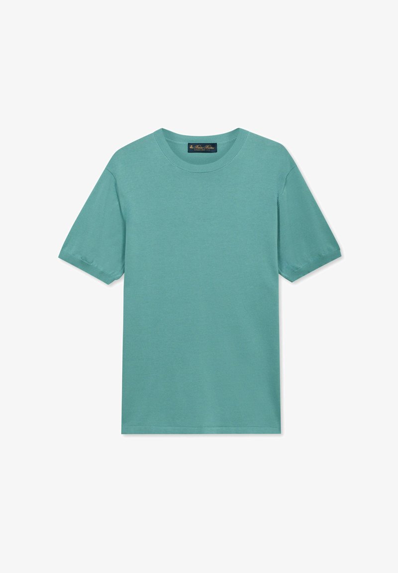 T-shirt unie bleu sarcelle à manches courtes avec col rond, comportant une petite étiquette en tissu à l'intérieur du col, sur fond blanc.
