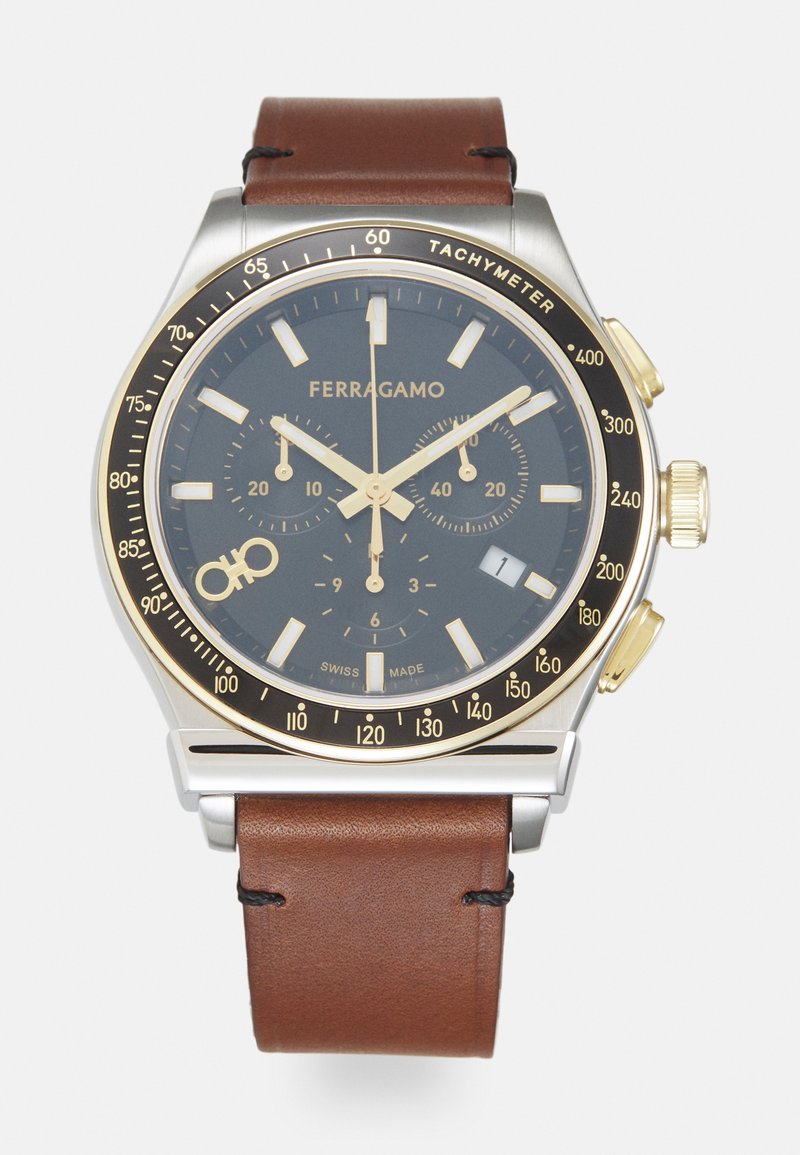 Orologio Ferragamo con cassa in acciaio inossidabile, cinturino in pelle marrone, quadrante blu scuro, dettagli dorati, funzioni cronografo e tachimetro.