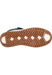 Sneakersool met een gestructureerd rubberen oppervlak, voorzien van een zigzagpatroon in bruin en wit. Rond neus met een embleem op de hak.