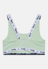 Svetlozelený bralet v jemnej látke. Obsahuje široké biele ramienka s textom "lovely" a tmavomodrý pás so srdiečkami. Klasický športový dizajn.