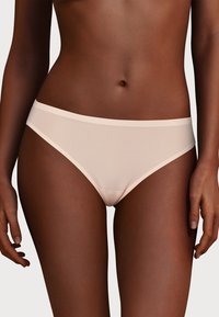 Light pink cotton bikini underwear with a smooth texture, featuring a comfortable waistband and minimalistic design.