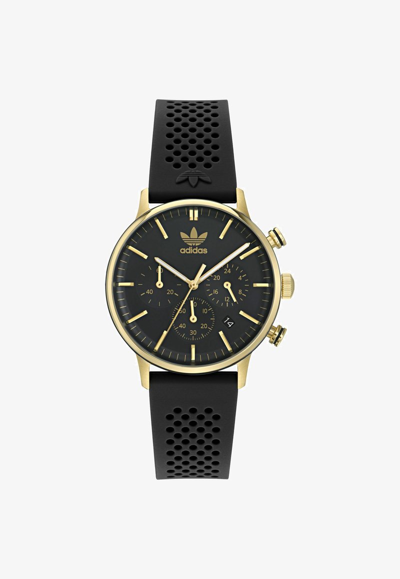 Melns hronogrāfa pulksteņi ar zelta akcentiem, gumijas siksna ar caurumiem, melns ciparnīca, zelta stundu atzīmes un logotips 12 stundām.