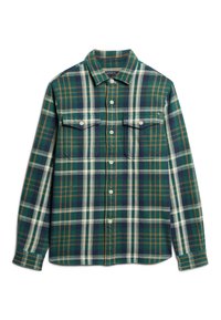 Camisa a cuadros verde y azul marino hecha de franela, con dos bolsillos en el pecho y cierres de botones. Tejido texturizado con líneas de acento en blanco y marrón.