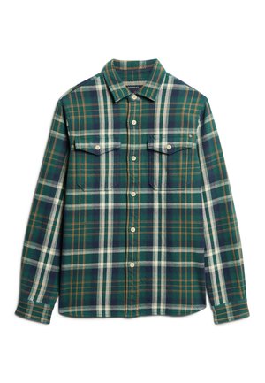 Grøn- og marineblå ternet skjorte lavet af flannel, med to brystlommer og knaplukninger. Struktureret stof med hvide og brune accentlinjer.