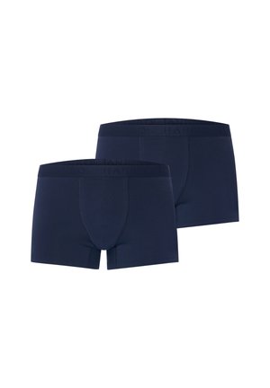 To par mørkeblå herreboxershorts med synligt syet frontpanel og elastiske taljebånd med mærke, vist mod en hvid baggrund.