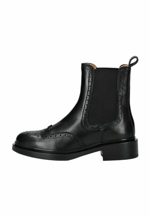 Bottines Chelsea en cuir noir avec des détails perforés et des panneaux élastiques sur les côtés. Bout arrondi, languette de tirage et petit talon rectangulaire. Texture lisse.