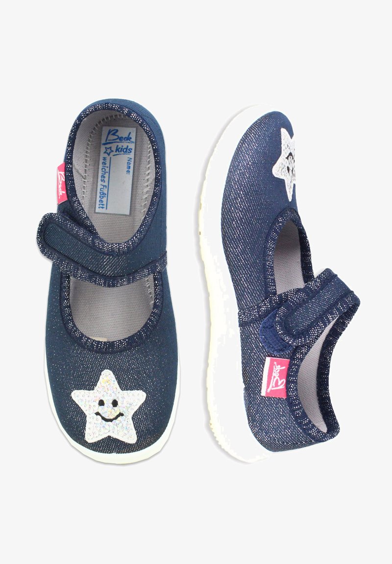 Dunkelblaue Stoffschuhe mit einem Sternmuster, weißer Sohle und Klettverschluss. Sie haben eine glitzernde Textur und ein lächelndes Gesicht auf dem Stern.