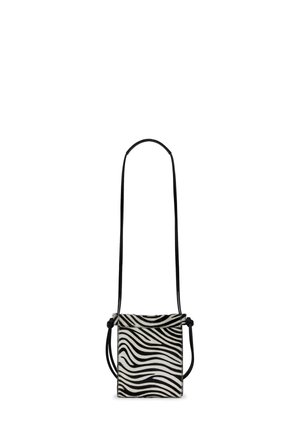 Black and white zebra print crossbody bag with a smooth texture, rectangular shape, thin black straps, and knotted detail accents.