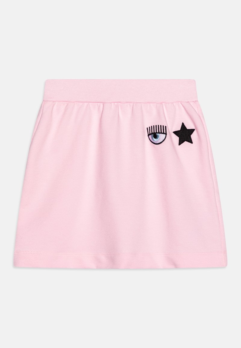 Jupe rose clair avec taille élastique, ornée d'un œil bleu brodé avec des cils et d'une étoile noire près du coin supérieur droit.