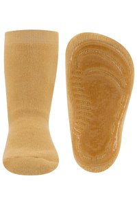 Gelbe Baumwollsocken mit einer strukturierten Sohle, die über Grip-Muster und einen glatten Bund verfügt. Das Design ist einfach und funktional für komfortablen Tragekomfort.