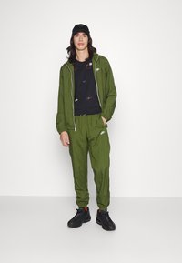 Nike Sportswear LOGO TEE - T-shirt estampada - black