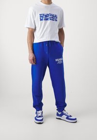 HUGO Träningsbyxor - blue